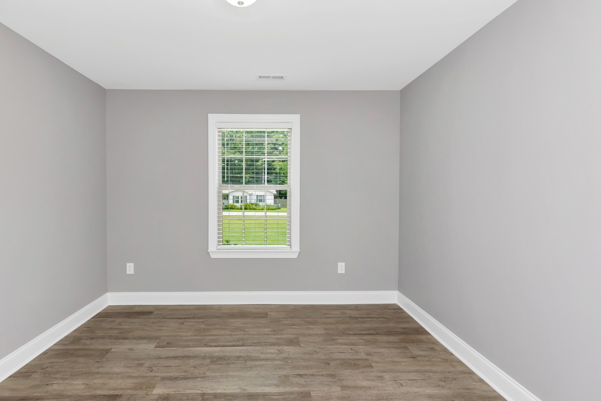28600 Reyer Road Ardmore, AL 35739 - Photo 23 of 28 a view of an empty room with wooden floor and a window