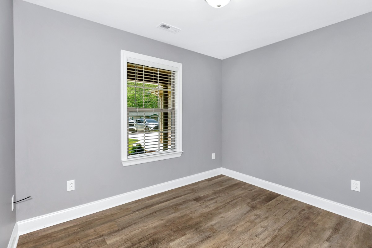 28600 Reyer Road Ardmore, AL 35739 - Photo 24 of 28 a view of an empty room with wooden floor and a window