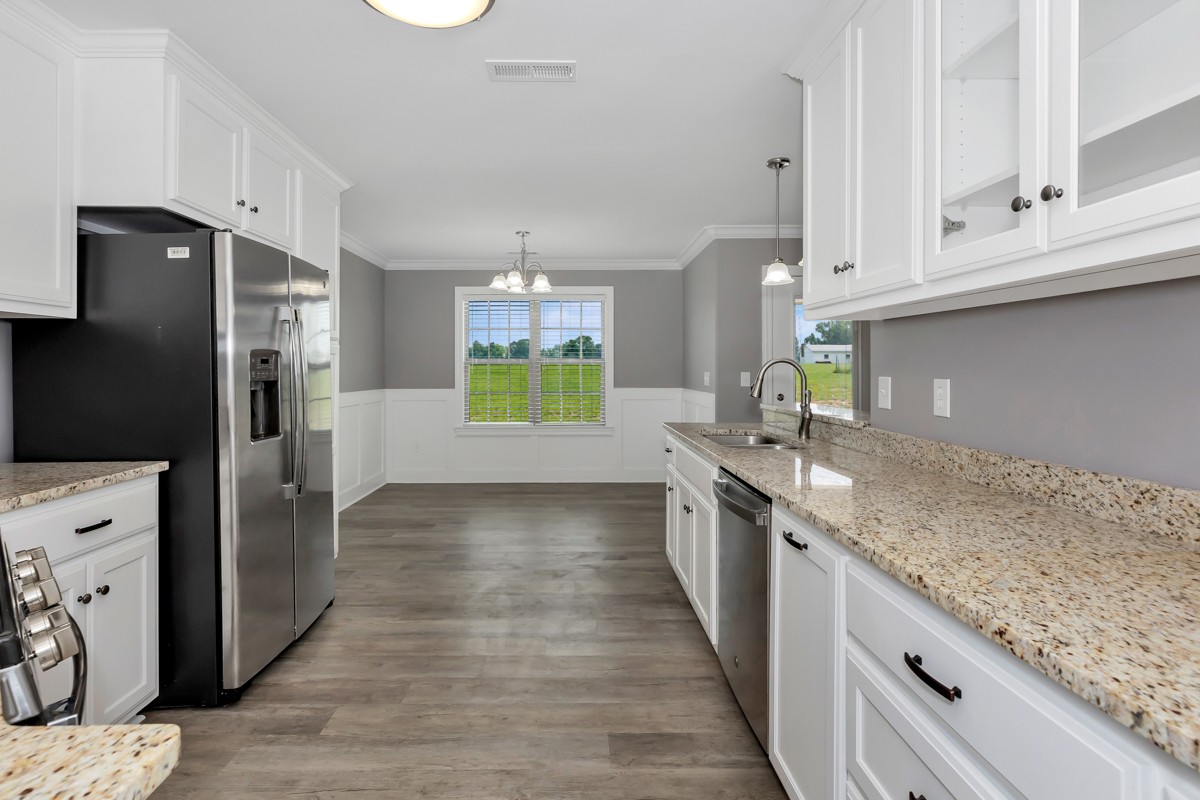 28600 Reyer Road Ardmore, AL 35739 - Photo 9 of 28 a kitchen with stainless steel appliances granite countertop a refrigerator and a sink