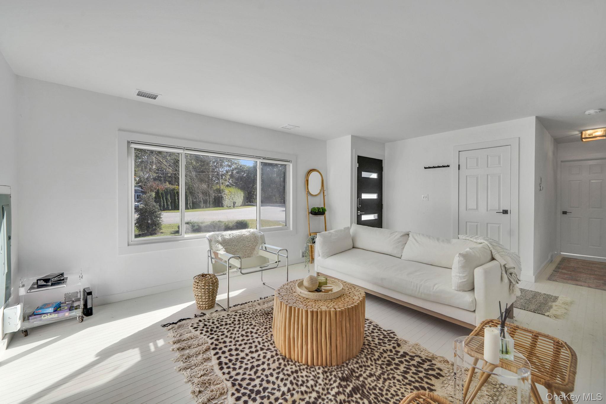 138 West Tiana Road Hampton Bays, NY 11946 - Photo 4 of 24 a living room with furniture and a window