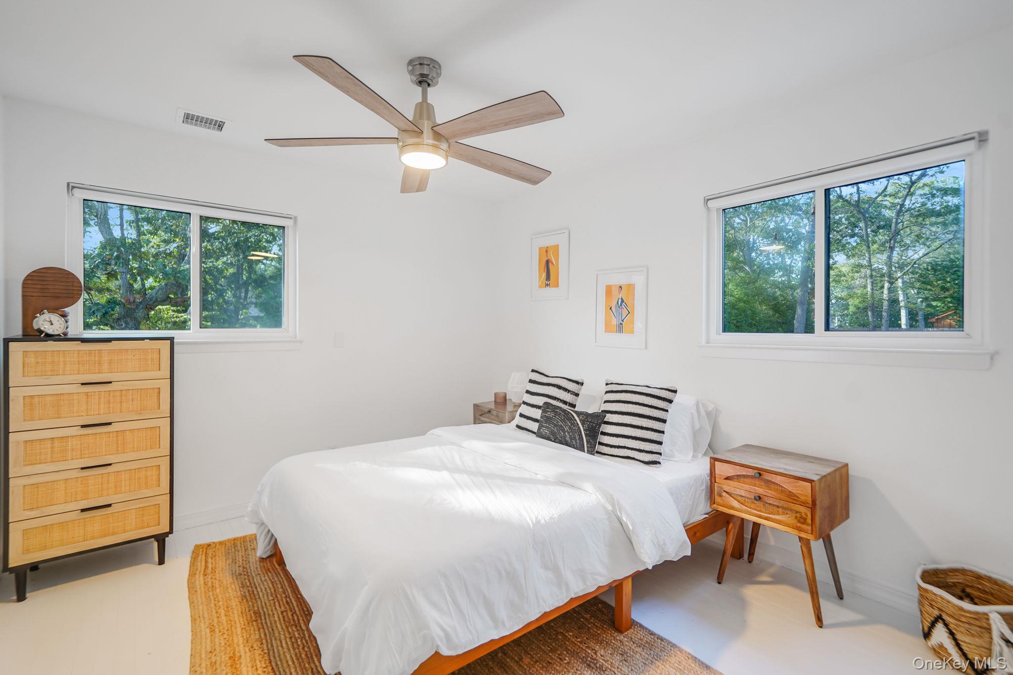 138 West Tiana Road Hampton Bays, NY 11946 - Photo 10 of 24 a bedroom with a bed and a window