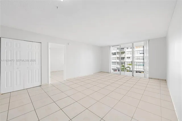 a kitchen with stainless steel appliances a refrigerator sink and microwave