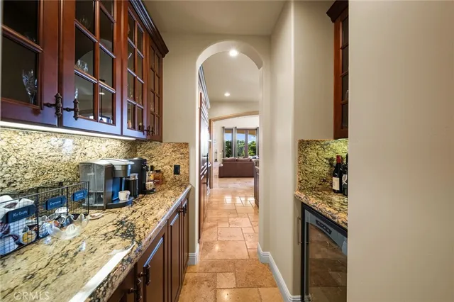 a bedroom with furniture and a flat screen tv