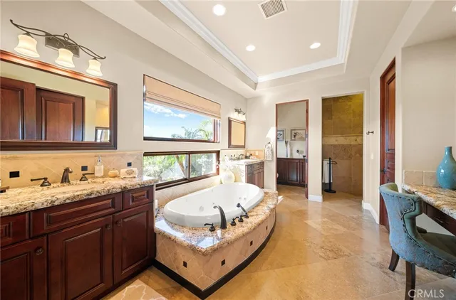 a bedroom with a large bed and a large window