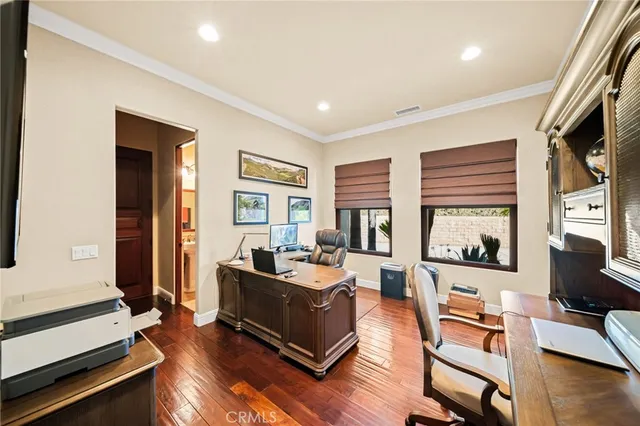 a building outdoor space with patio furniture and potted plants