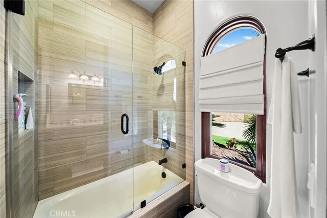 a view of swimming pool with outdoor seating and city view