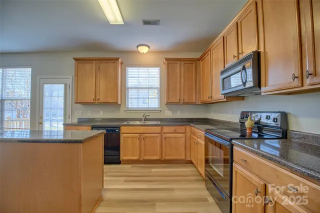 a living room with furniture fireplace and a flat screen tv