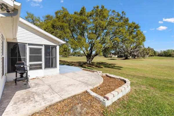 a view of a yard with swimming pool