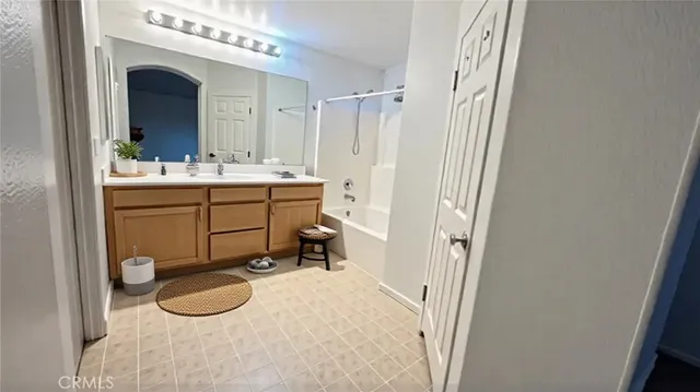 a bathroom with a sink a vanity and a mirror