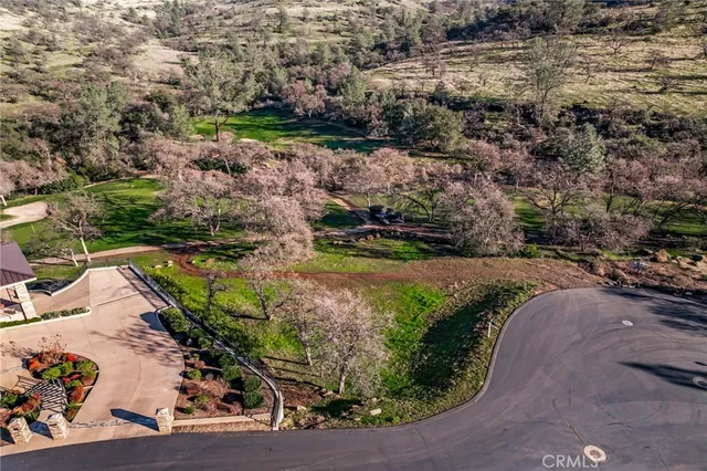 an aerial view of a house with a swimming pool