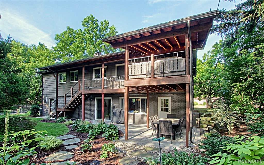 7120 Pebblecreek Road West Bloomfield, MI 48322 - Photo 3 of 31 Multi-level wood deck and covered patio with string lights