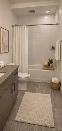 a bathroom with a tub a sink and a shower