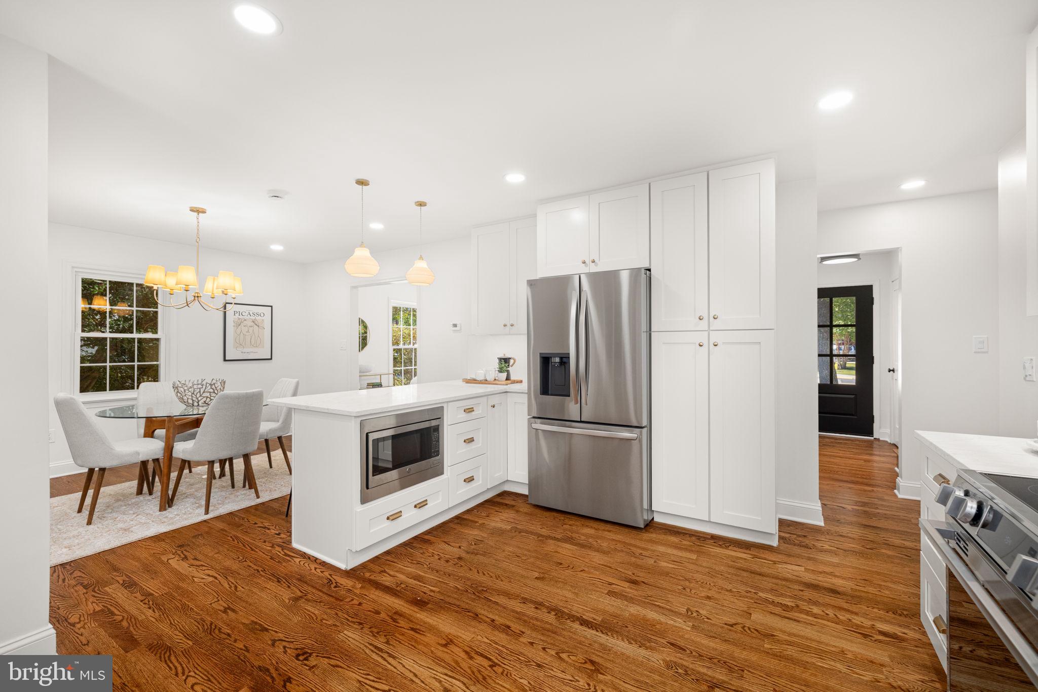 8415 Riverside Road Alexandria, VA 22308 - Photo 11 of 44 a kitchen with stainless steel appliances a refrigerator sink and cabinets