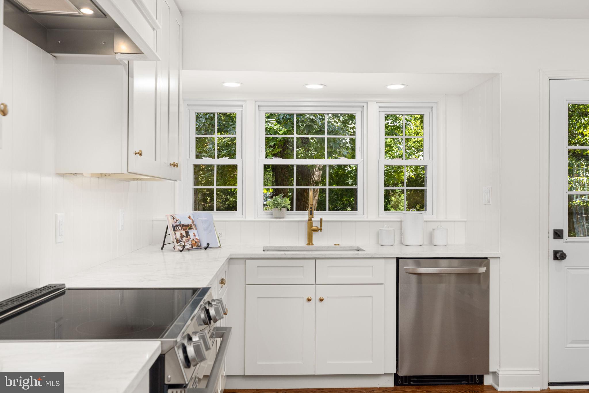 8415 Riverside Road Alexandria, VA 22308 - Photo 12 of 44 a kitchen with a sink and a window