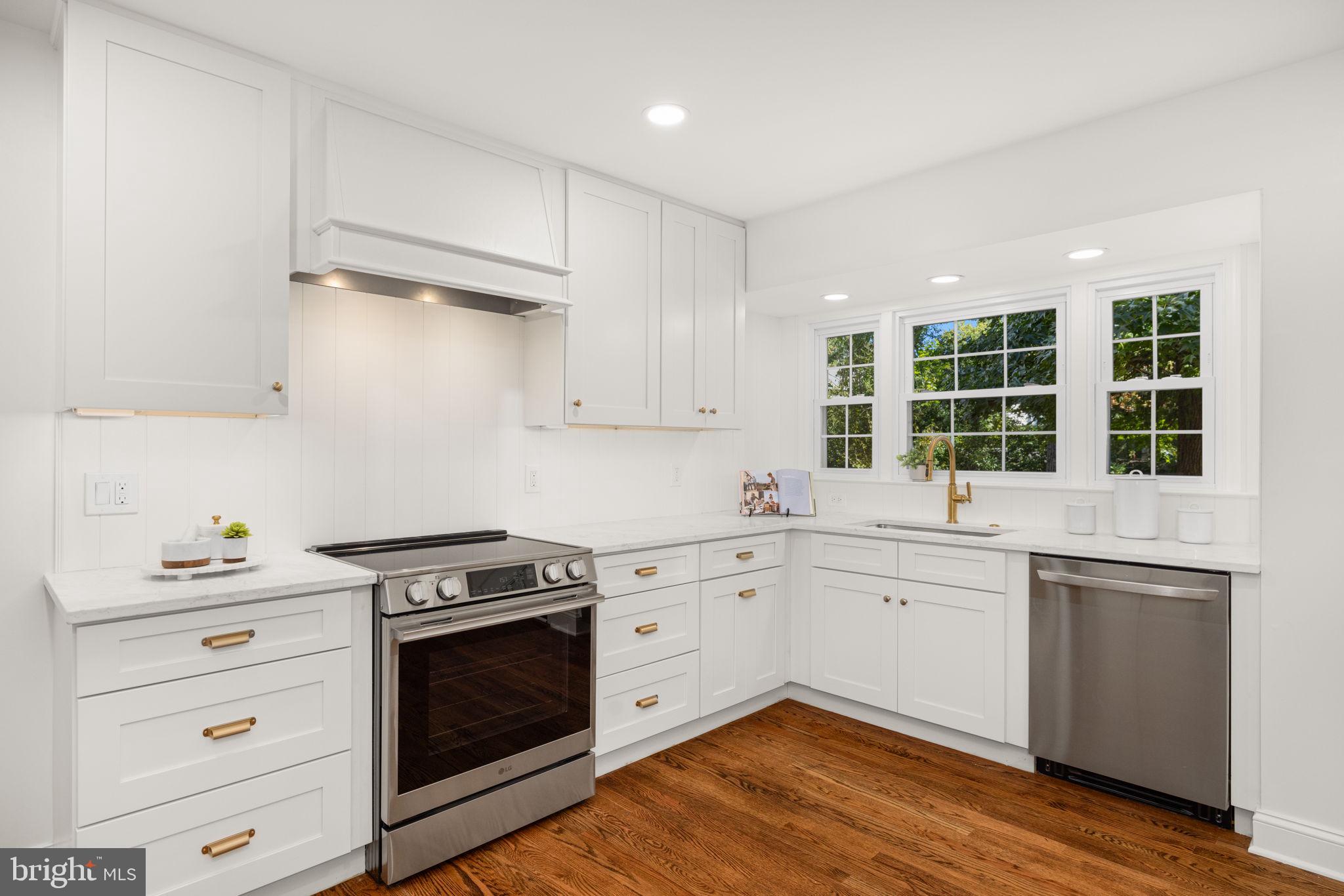 8415 Riverside Road Alexandria, VA 22308 - Photo 14 of 44 a kitchen with granite countertop cabinets stainless steel appliances and sink