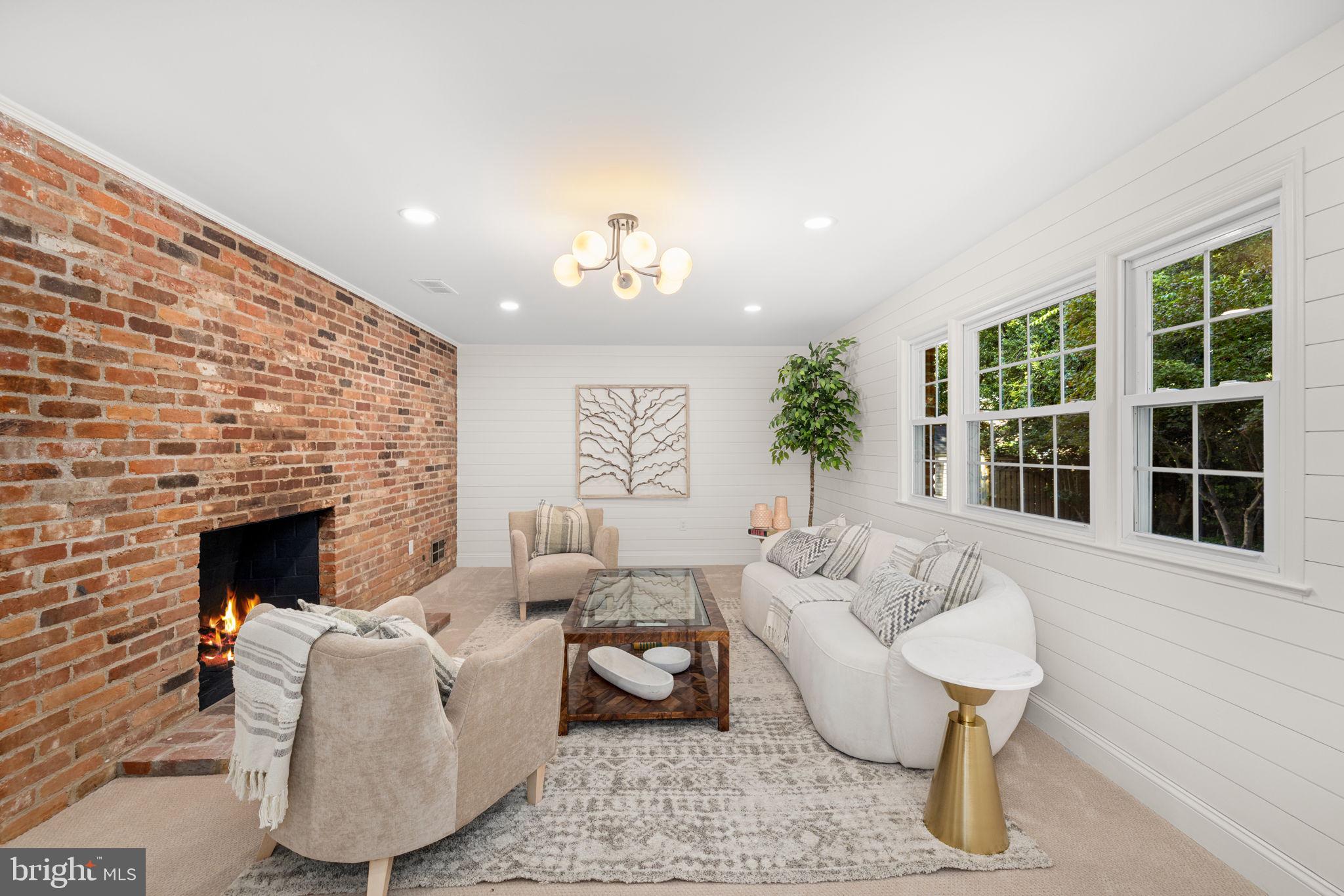 8415 Riverside Road Alexandria, VA 22308 - Photo 15 of 44 a living room with furniture and a fireplace