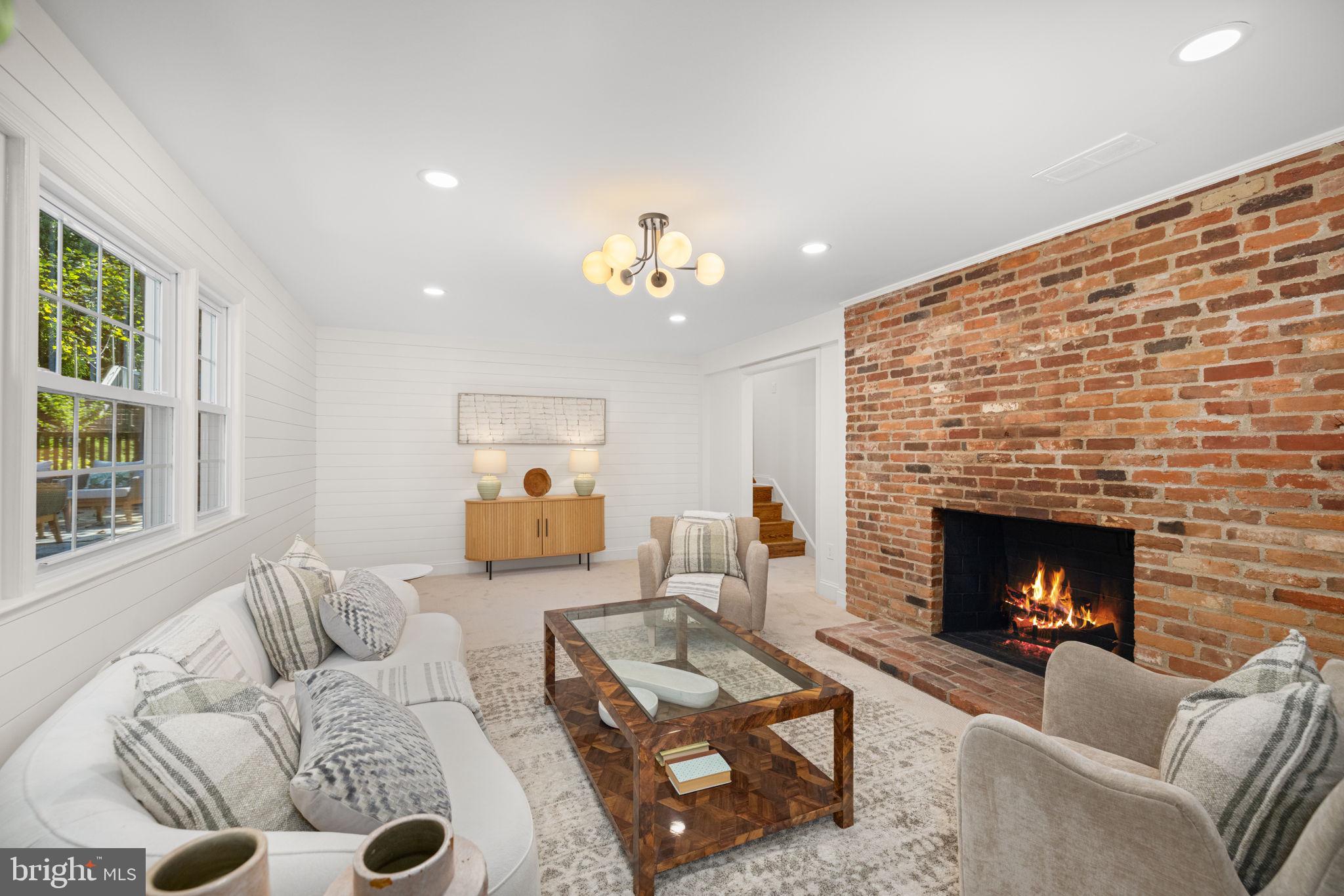 8415 Riverside Road Alexandria, VA 22308 - Photo 16 of 44 a living room with furniture and a fireplace
