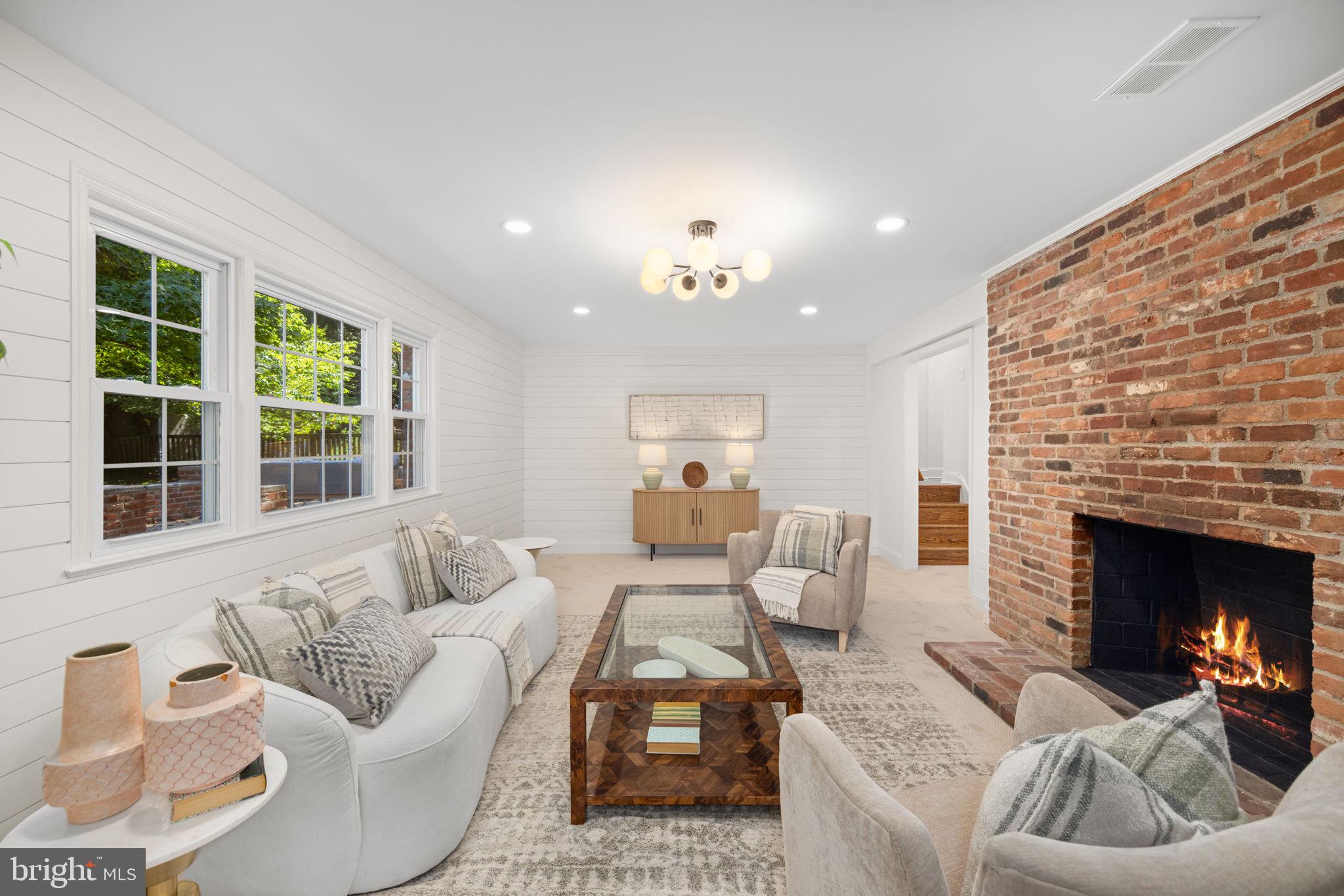 8415 Riverside Road Alexandria, VA 22308 - Photo 17 of 44 a living room with furniture and a fireplace