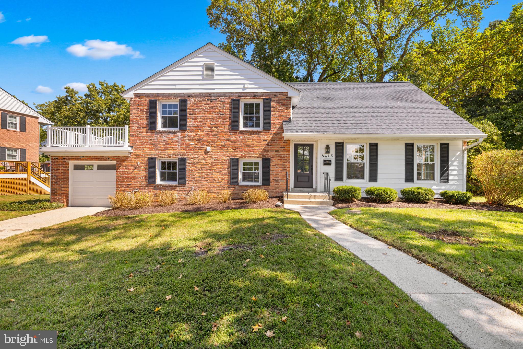 8415 Riverside Road Alexandria, VA 22308 - Photo 2 of 44 a front view of a house with a yard