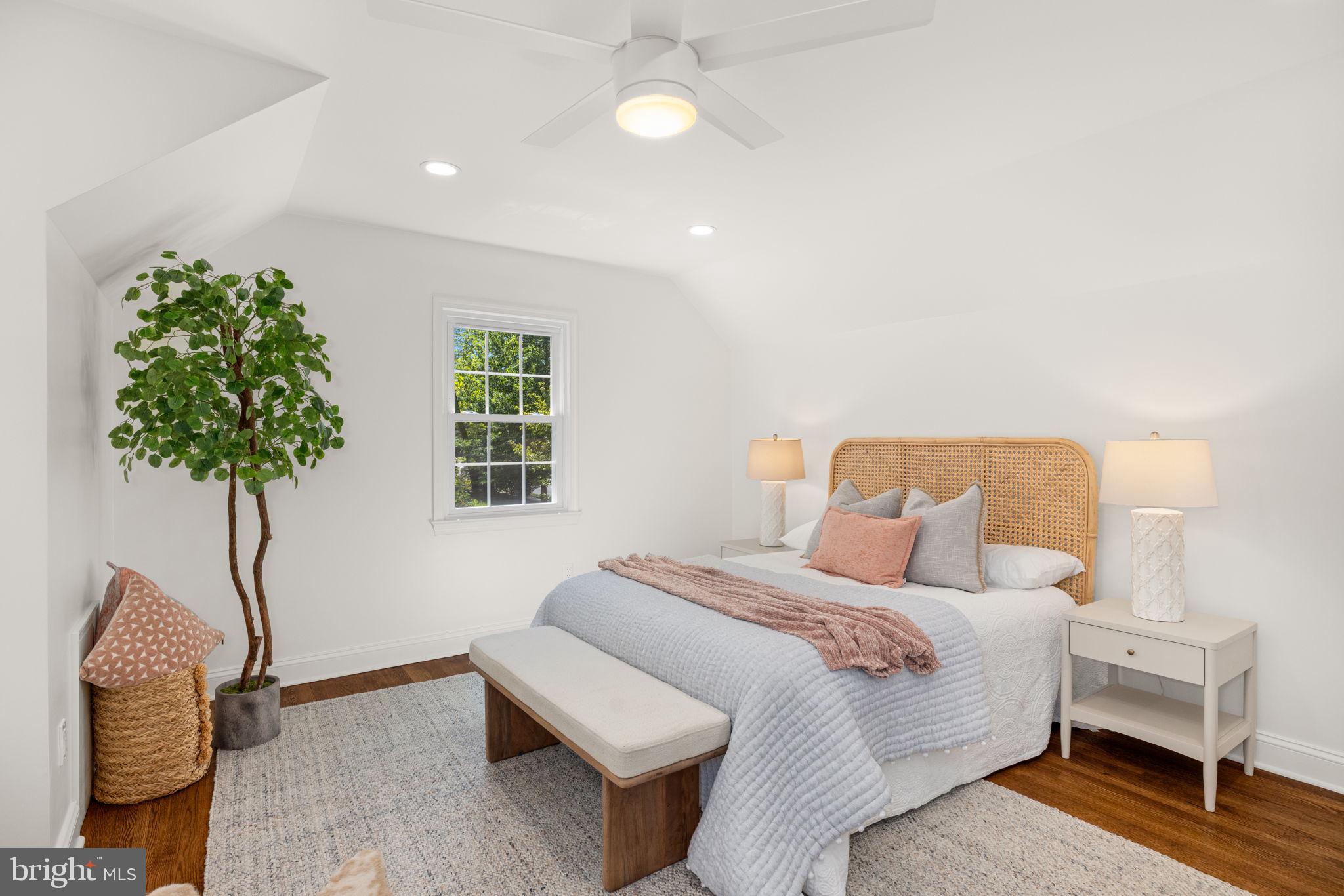 8415 Riverside Road Alexandria, VA 22308 - Photo 28 of 44 a bedroom with a bed and a night stand