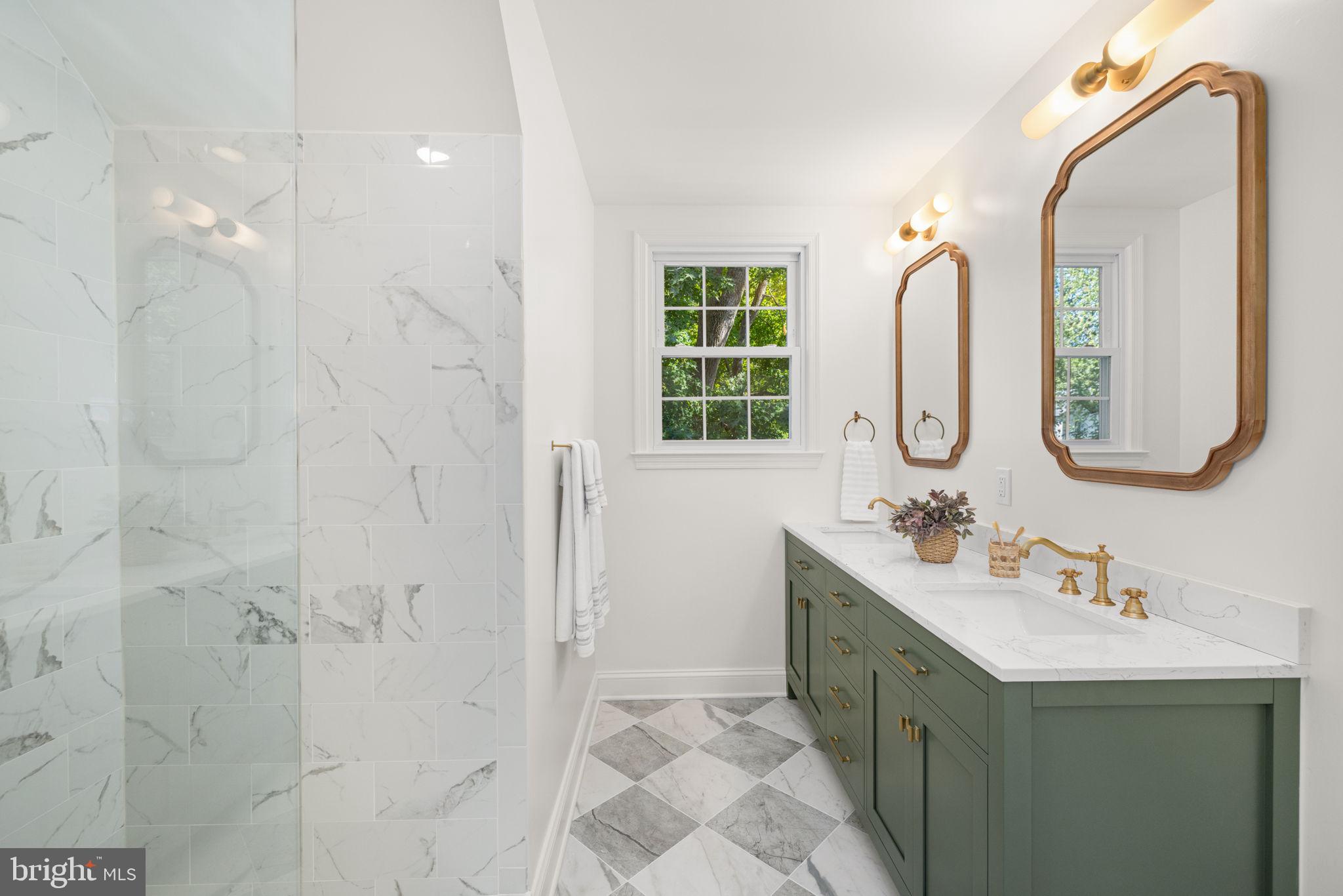 8415 Riverside Road Alexandria, VA 22308 - Photo 31 of 44 a bathroom with a double vanity sink mirror and bathtub