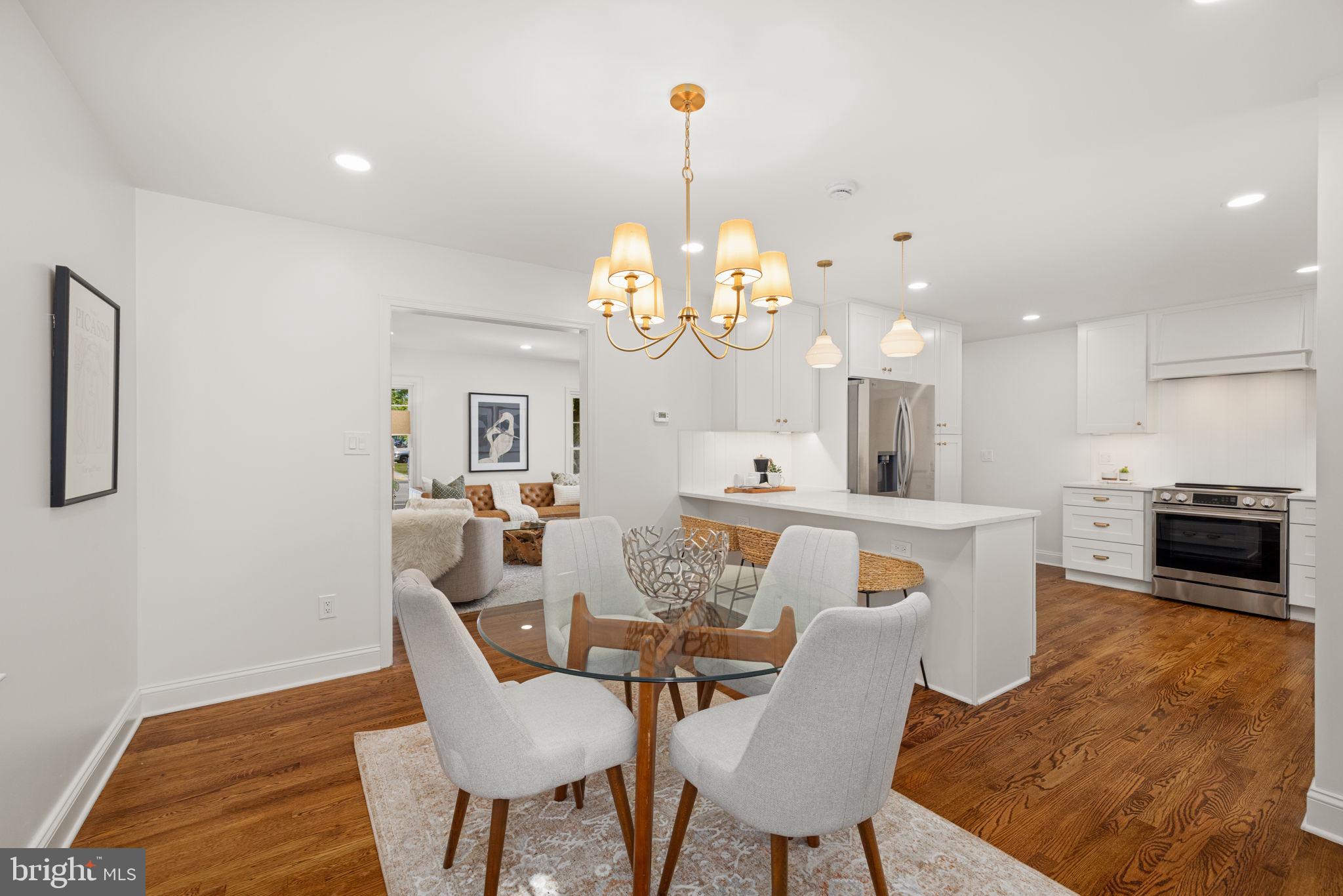 8415 Riverside Road Alexandria, VA 22308 - Photo 6 of 44 a view of a dining room with furniture and wooden floor