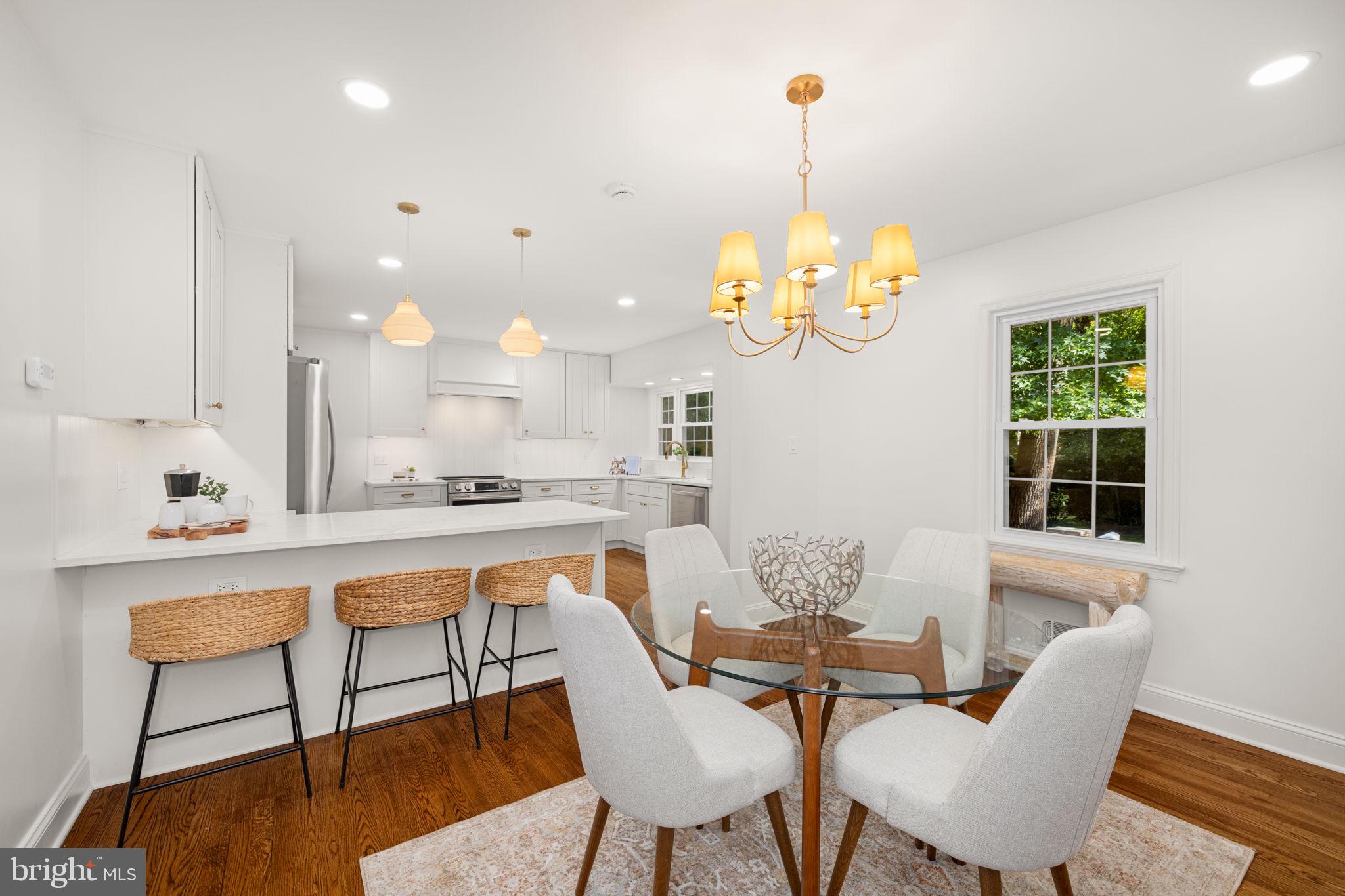 8415 Riverside Road Alexandria, VA 22308 - Photo 7 of 44 a dining room filled chandelier and wooden floor