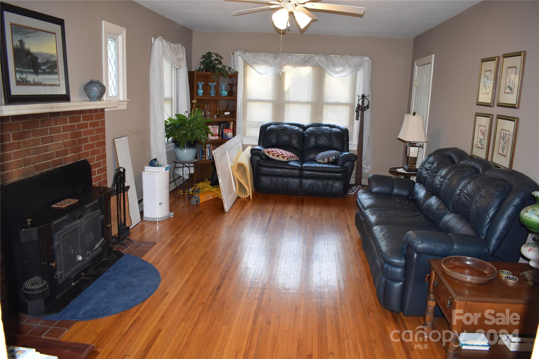 25 Cypress Road Marion, NC 28752 - Photo 14 of 48 a living room with furniture fireplace and wooden floor