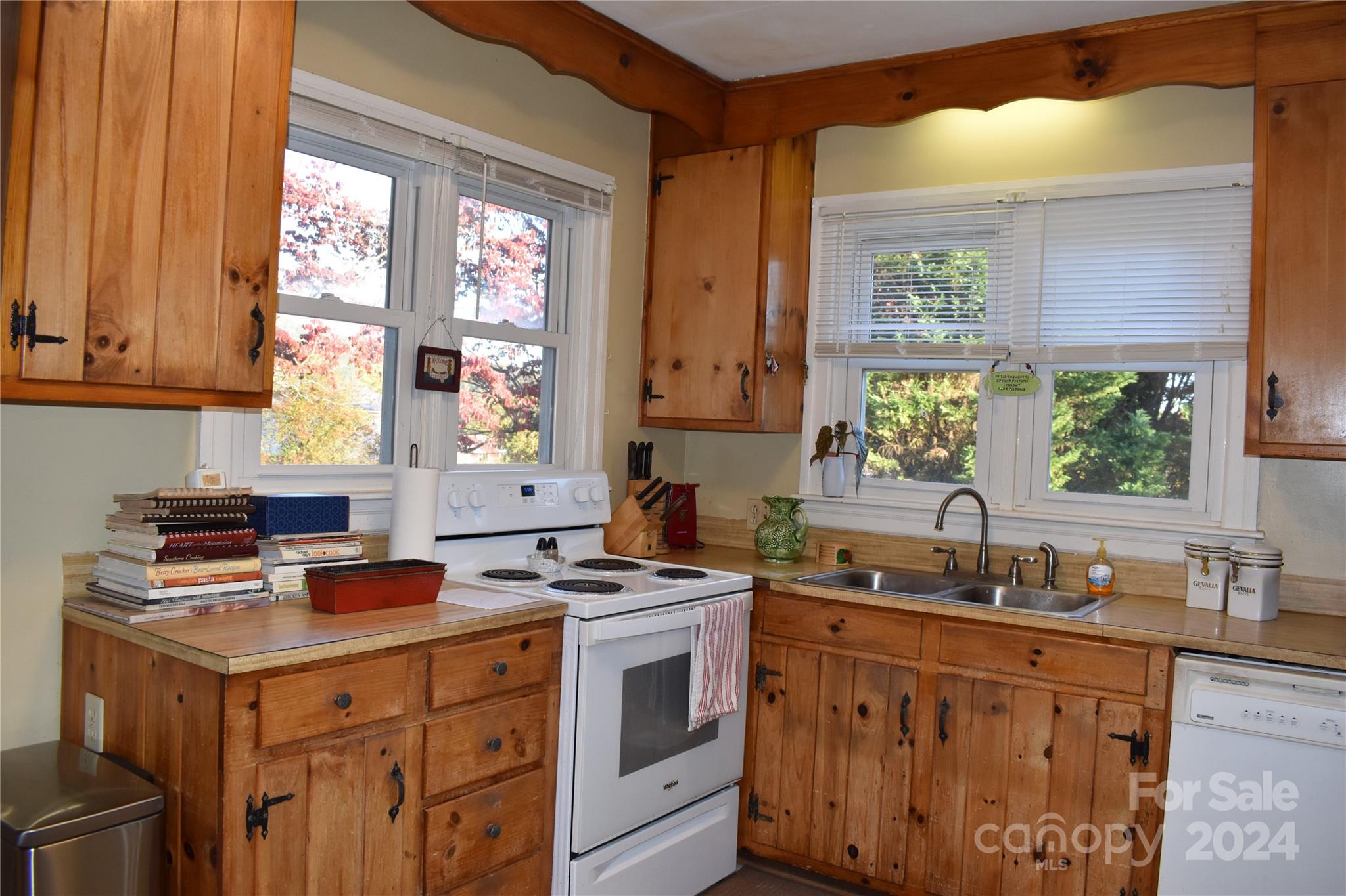 25 Cypress Road Marion, NC 28752 - Photo 16 of 48 a kitchen with stainless steel appliances a sink stove and window