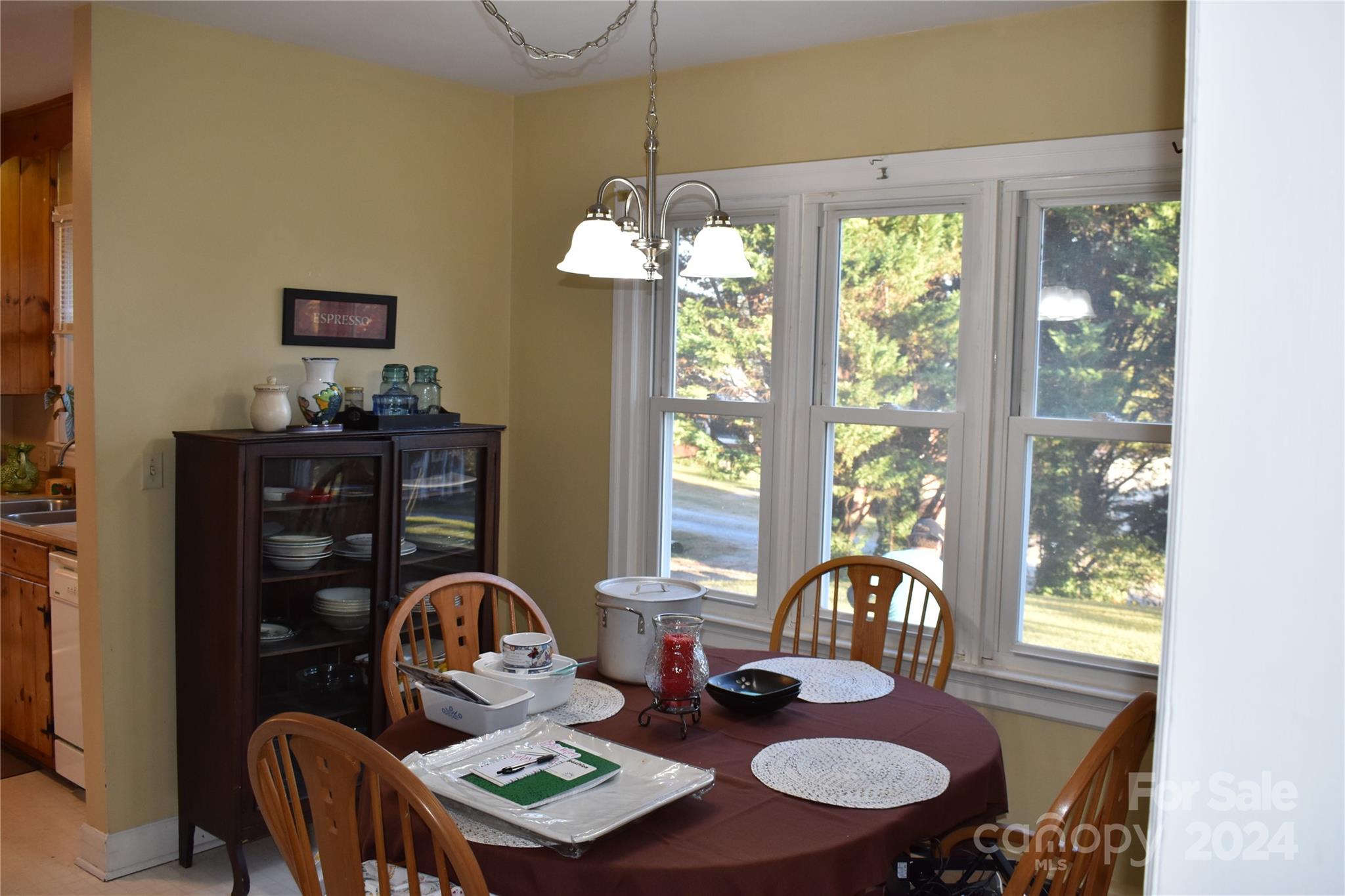 25 Cypress Road Marion, NC 28752 - Photo 19 of 48 a view of a dining room with furniture wooden floor and chandelier