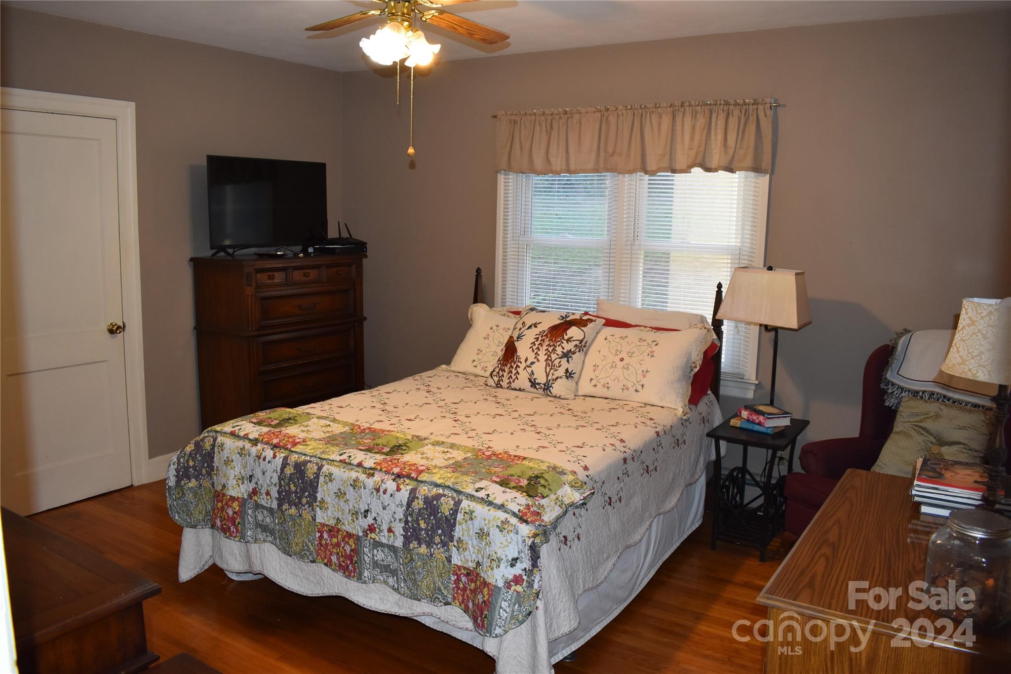 25 Cypress Road Marion, NC 28752 - Photo 23 of 48 a bedroom with a bed and a flat tv screen on a dresser