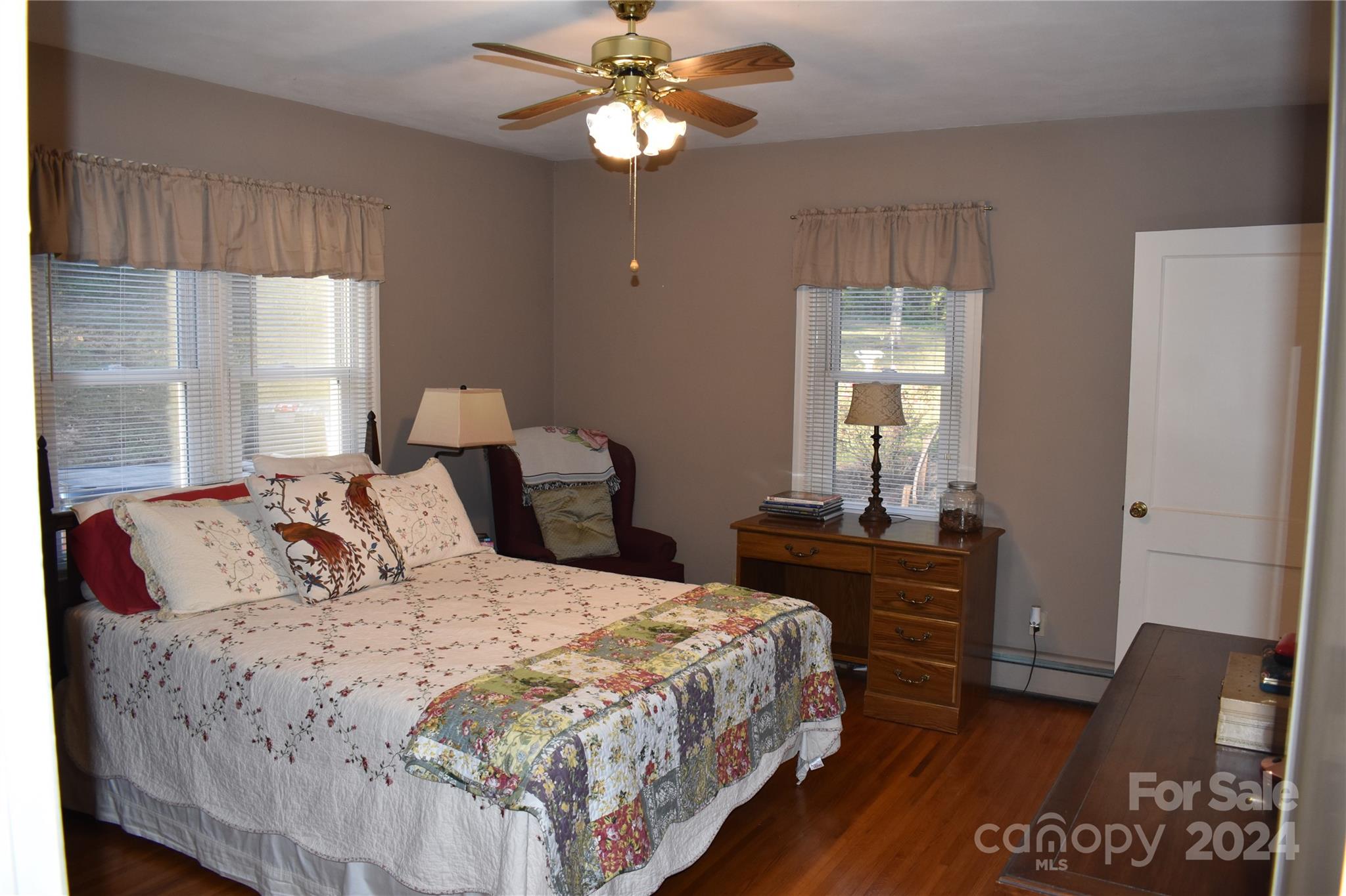 25 Cypress Road Marion, NC 28752 - Photo 24 of 48 a bedroom with a bed and a chandelier