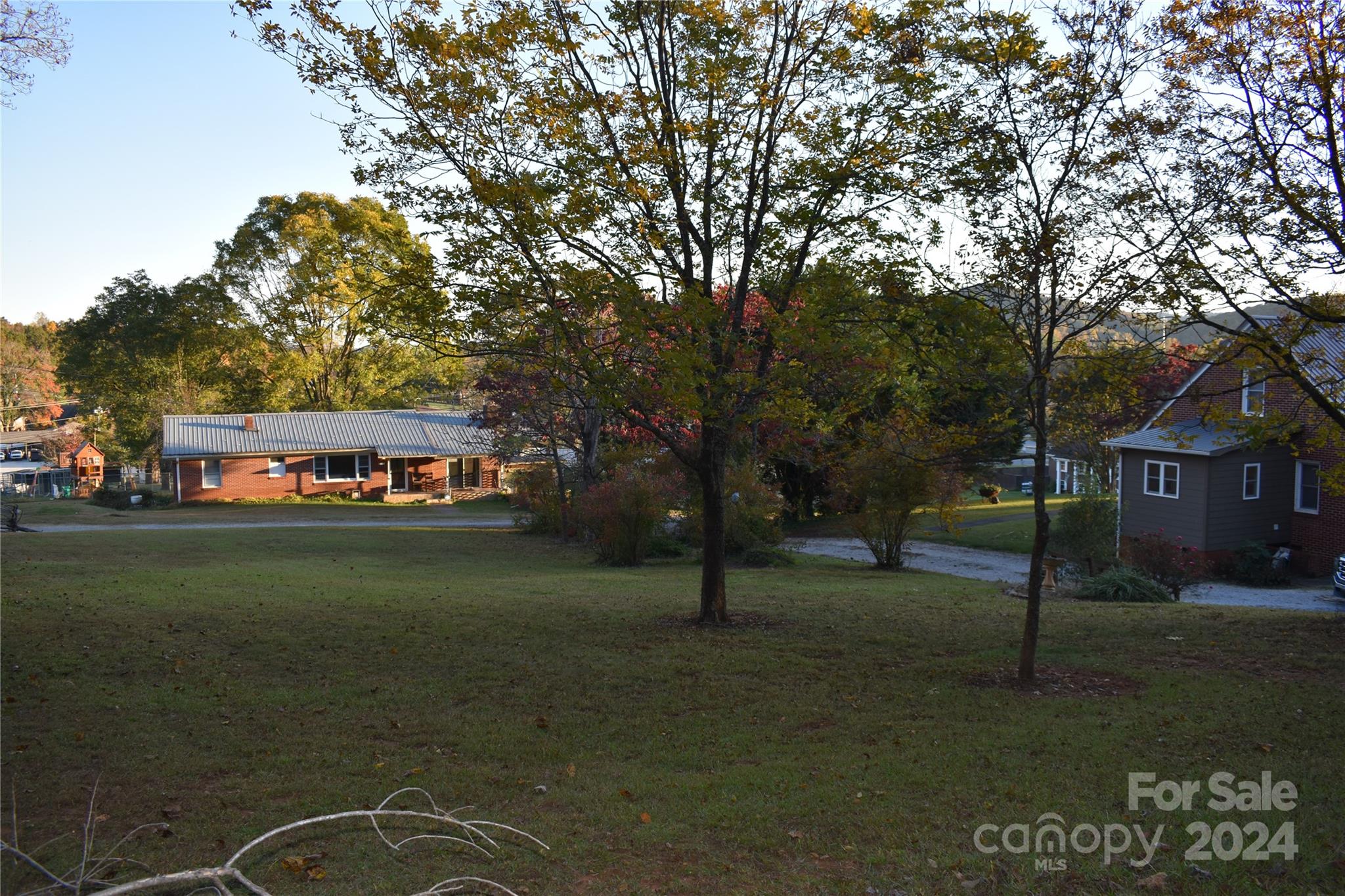 25 Cypress Road Marion, NC 28752 - Photo 42 of 48 a view of a big house with a big yard and large trees