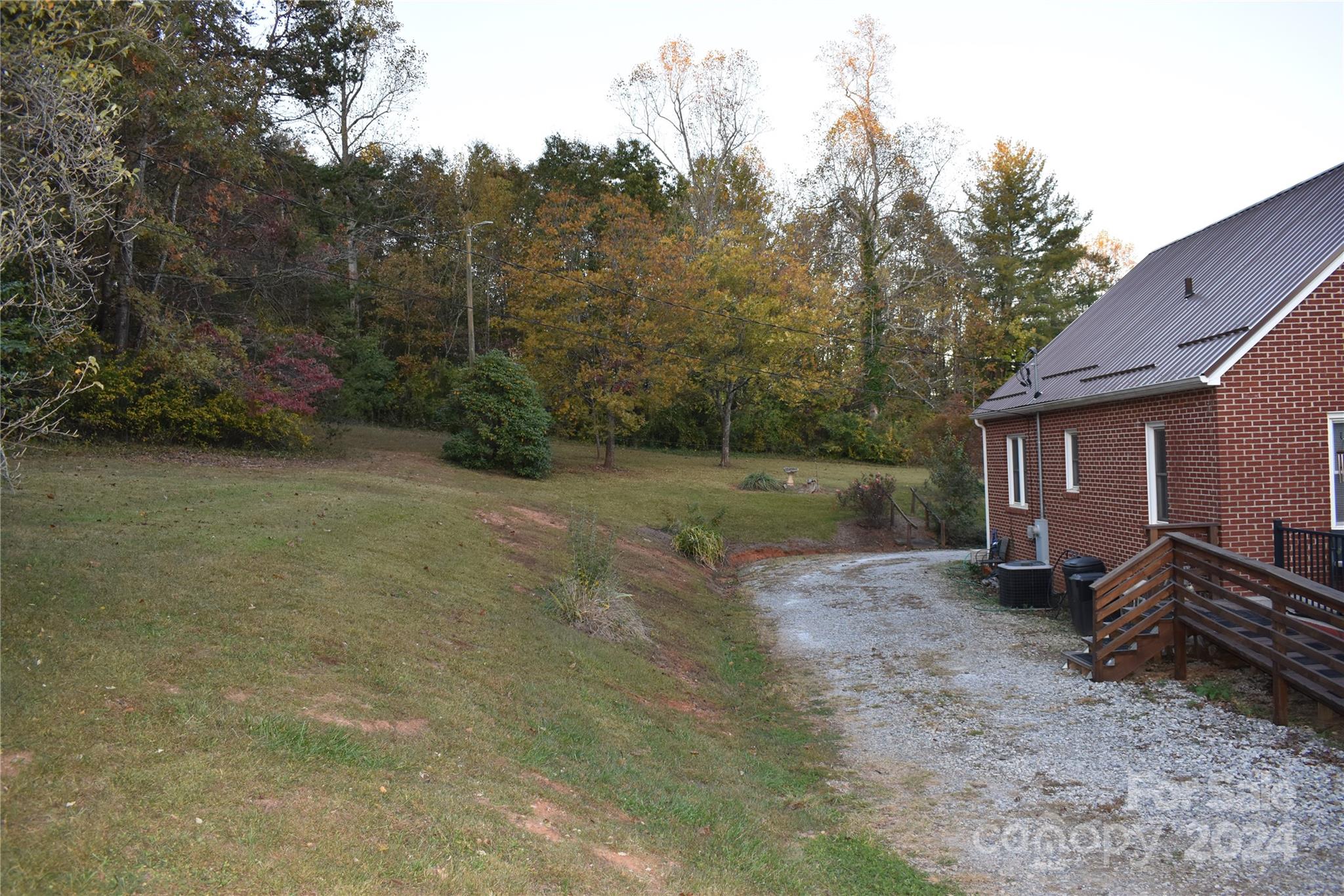 25 Cypress Road Marion, NC 28752 - Photo 45 of 48 a view of a backyard with large trees