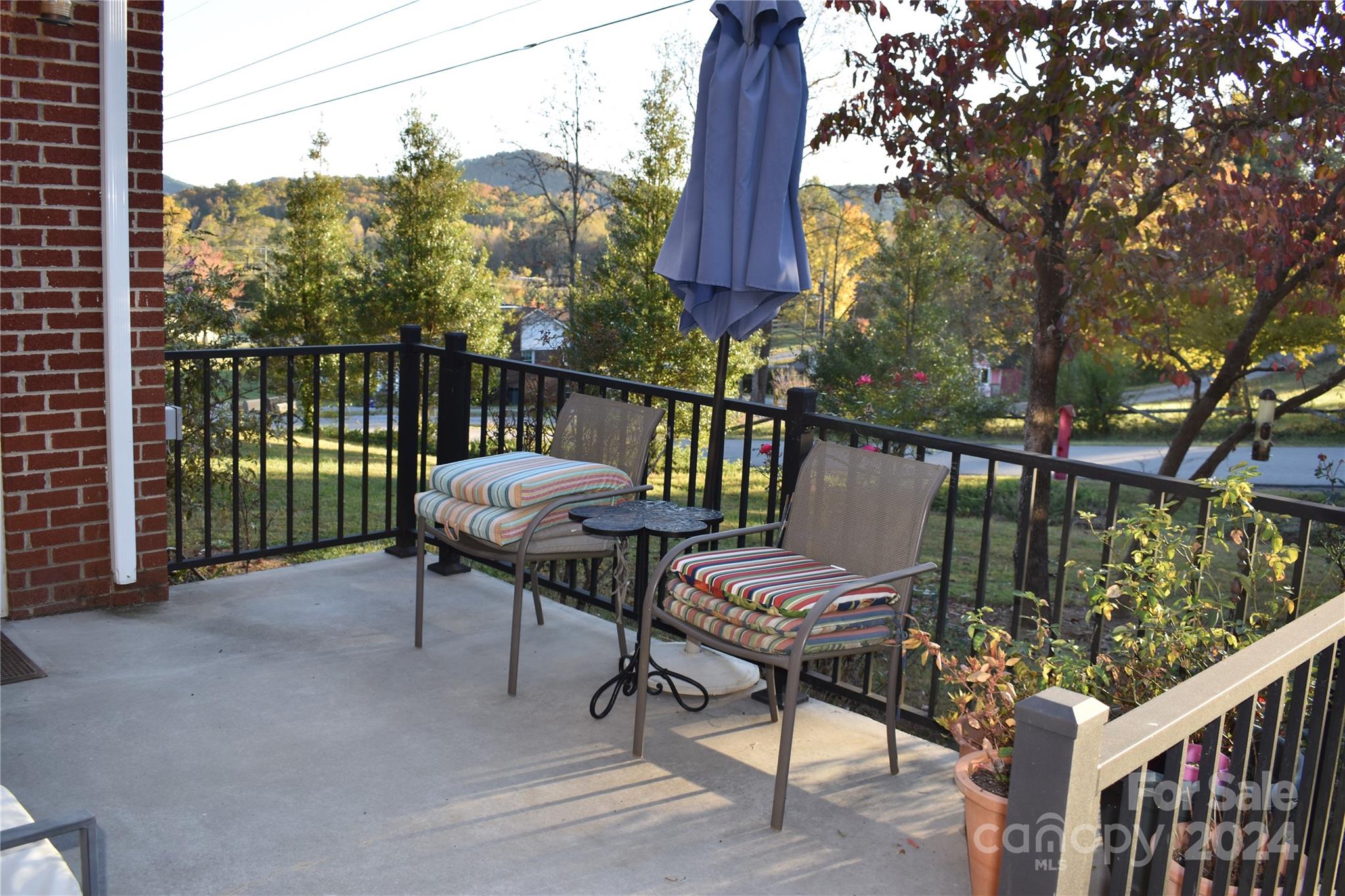 25 Cypress Road Marion, NC 28752 - Photo 6 of 48 a view of a chairs and table in the deck