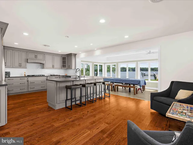 a view of a livingroom with furniture and windows in a room