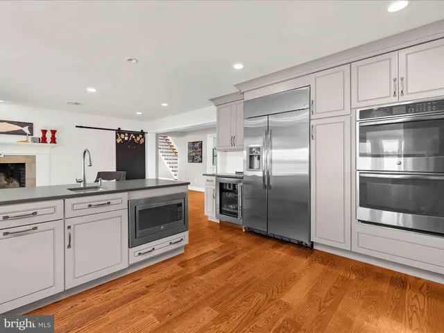 a spacious bedroom with a large bed and a window