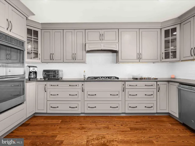 a spacious bedroom with a bed and a window