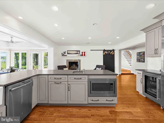 a bathroom with a double vanity sink a mirror and a bathtub