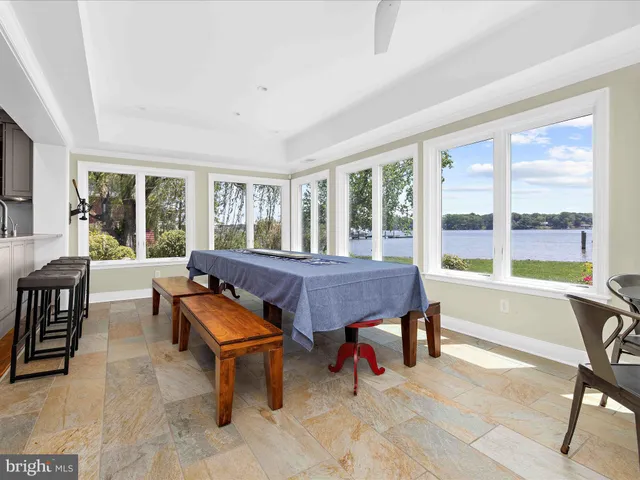 a bedroom with a bed a fireplace and a window