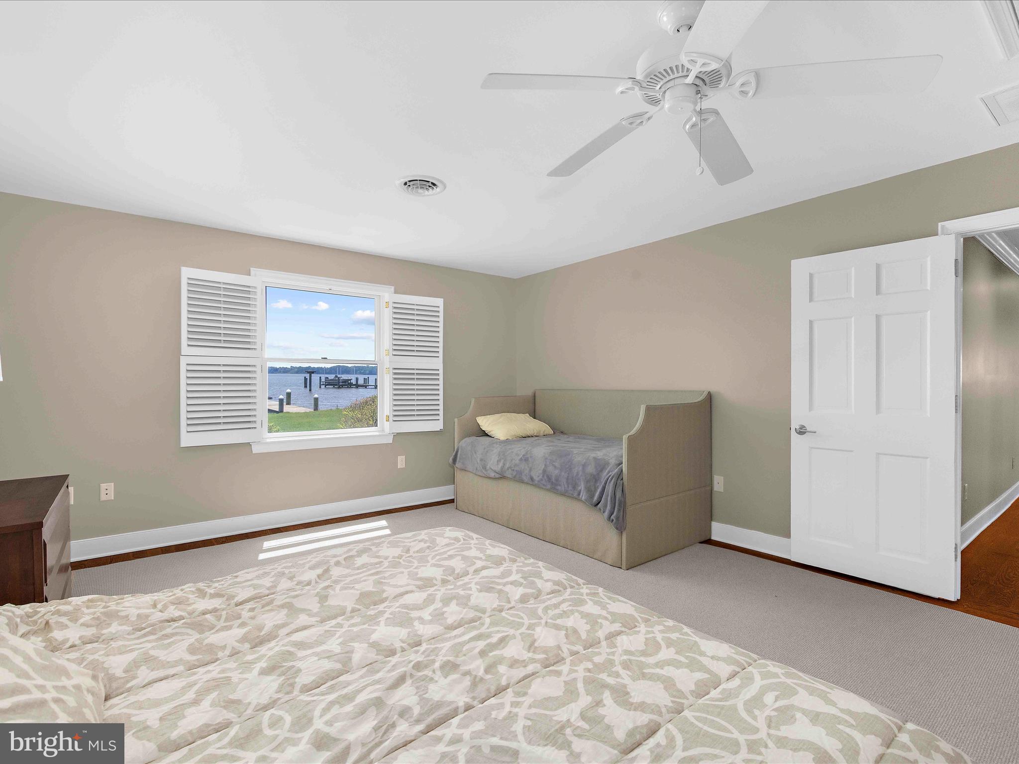 7961 Quaker Neck Road Chestertown, MD 21620 - Photo 30 of 93 a spacious bedroom with a large bed and a window