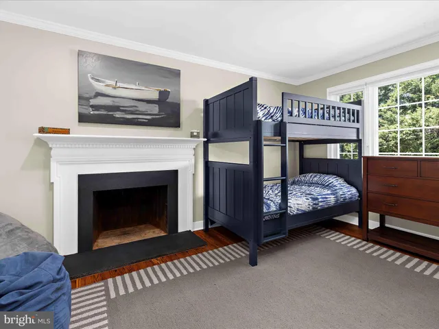 a view of a house with backyard sitting area and garden