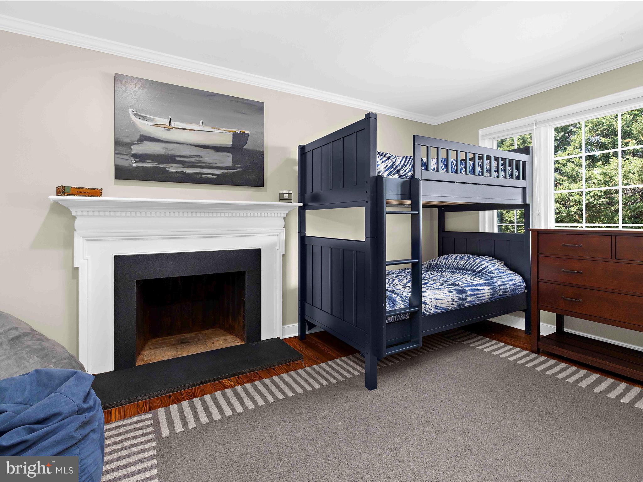 7961 Quaker Neck Road Chestertown, MD 21620 - Photo 37 of 93 a bedroom with a bed a fireplace and a window