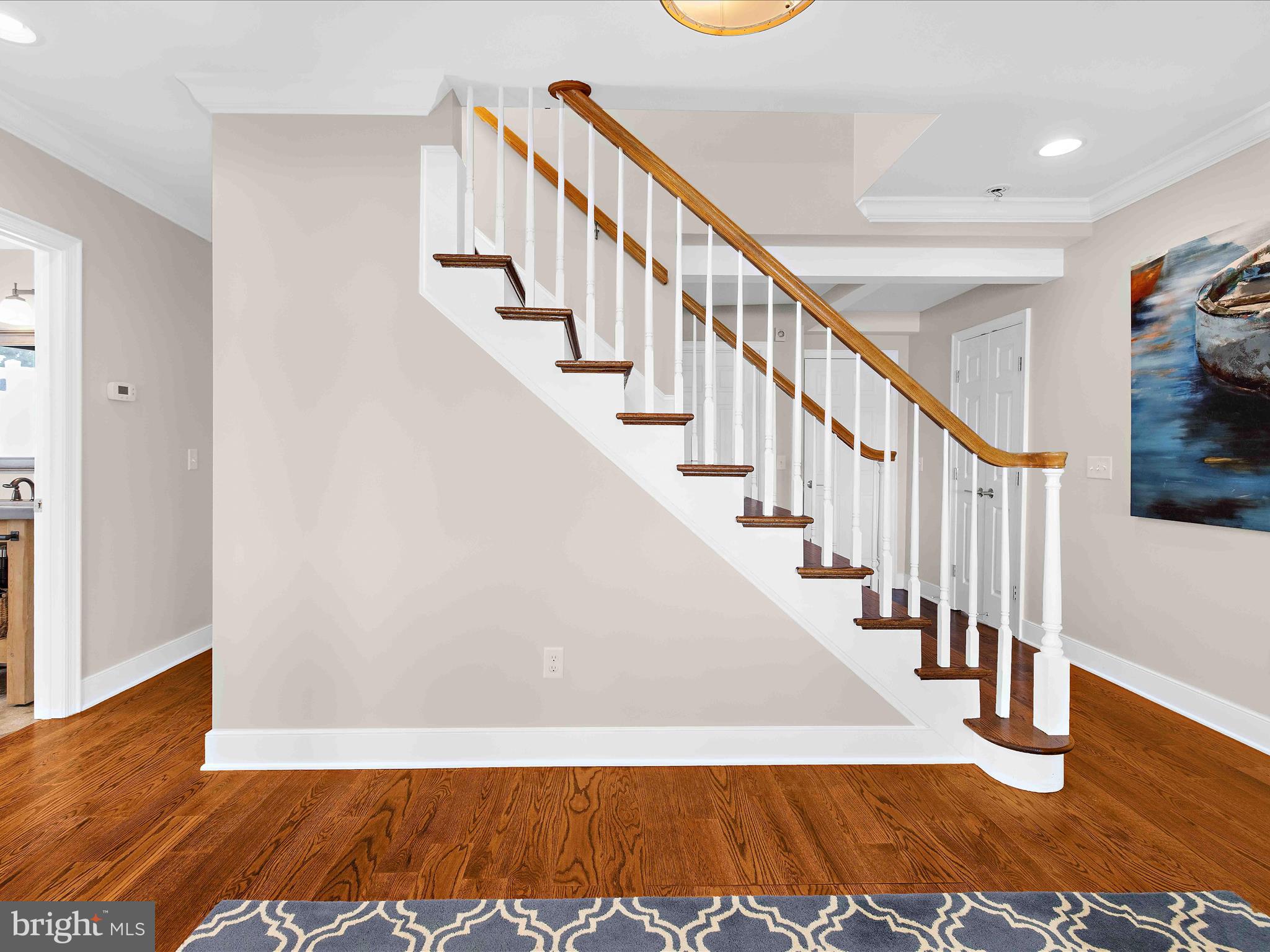 7961 Quaker Neck Road Chestertown, MD 21620 - Photo 47 of 93 a view of staircase with wooden floor and a rug