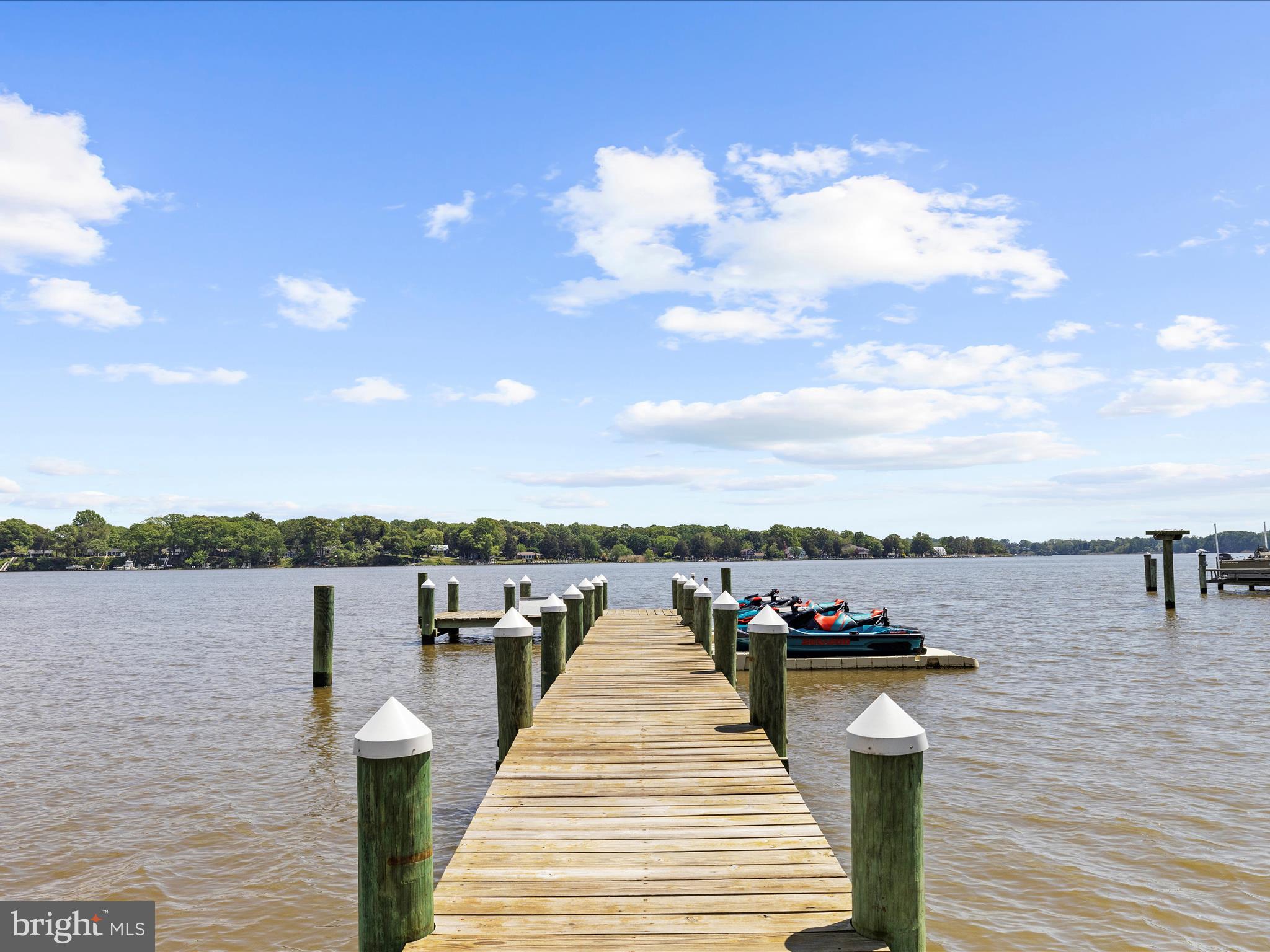 7961 Quaker Neck Road Chestertown, MD 21620 - Photo 5 of 93 a view of a lake with boats and trees in the background