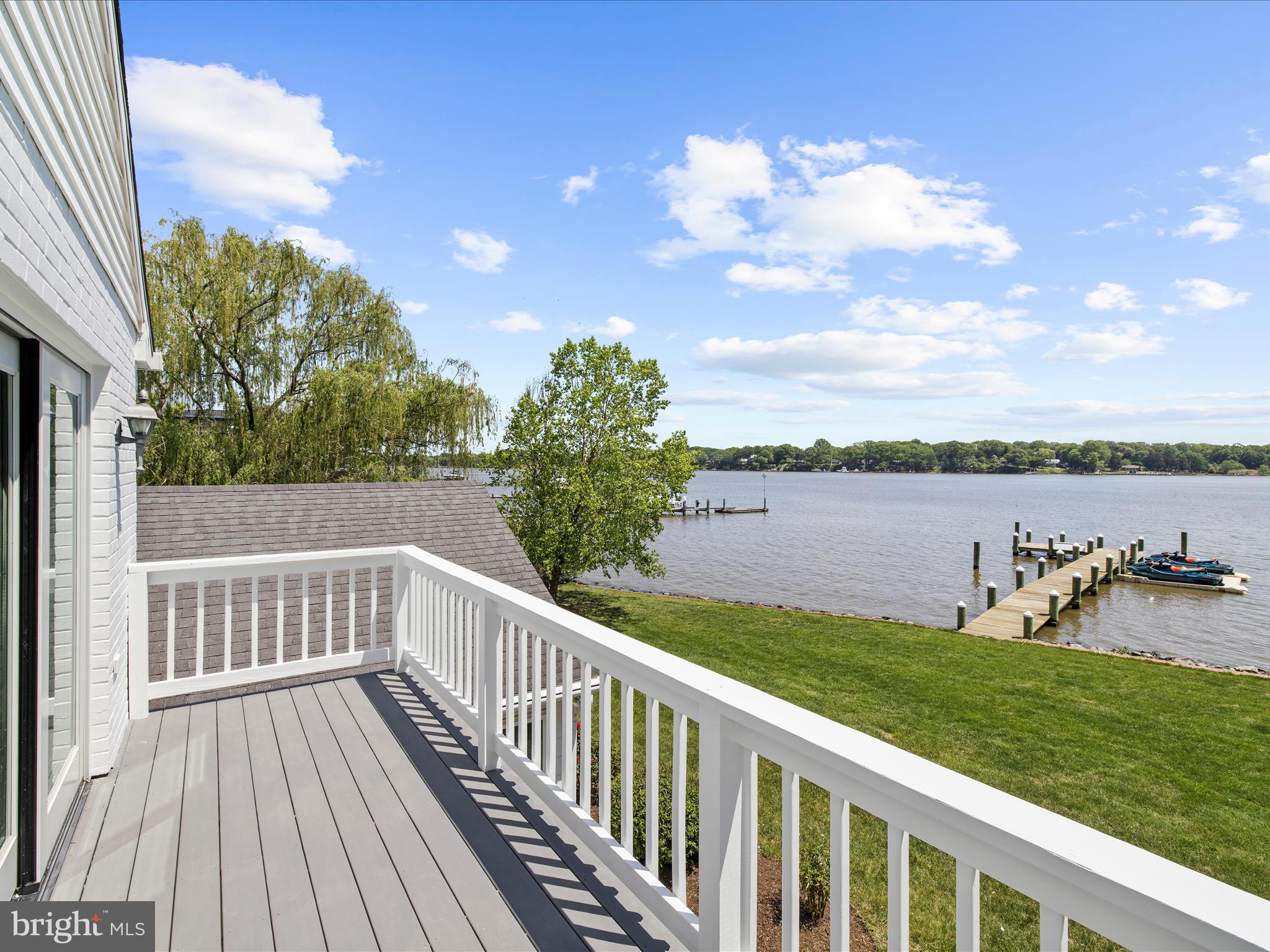 7961 Quaker Neck Road Chestertown, MD 21620 - Photo 55 of 93 a view of a deck with chairs and a yard with wooden fence