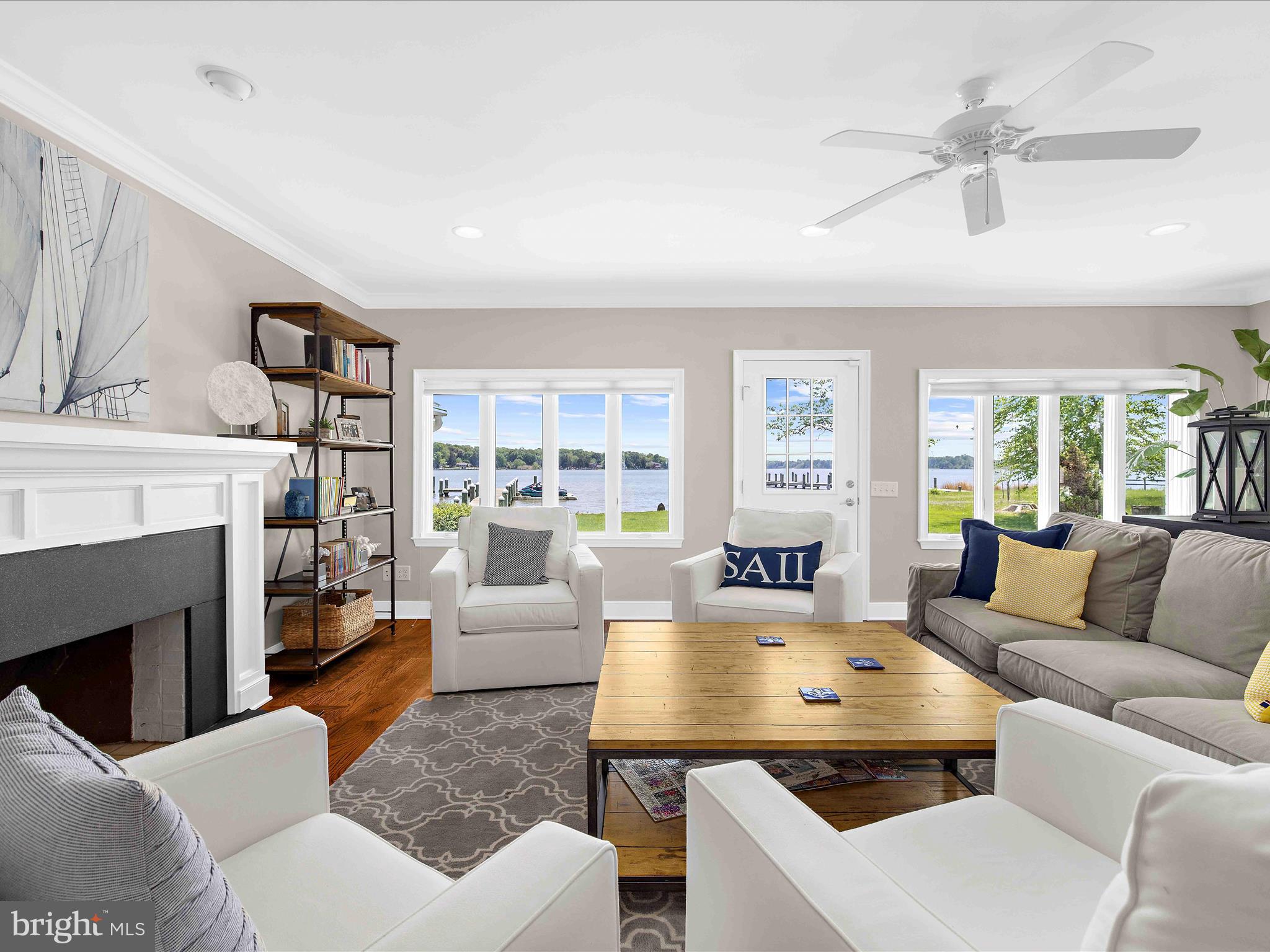 7961 Quaker Neck Road Chestertown, MD 21620 - Photo 8 of 93 a living room with furniture fireplace and a large window