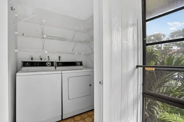 a utility room with dryer and washer
