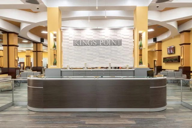 a living room with furniture window and wooden floor