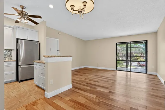 a view of a kitchen with a stove cabinets and wooden floor